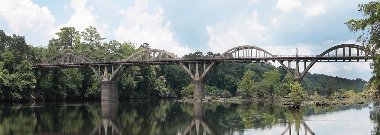photo of a large concrete bridge over water